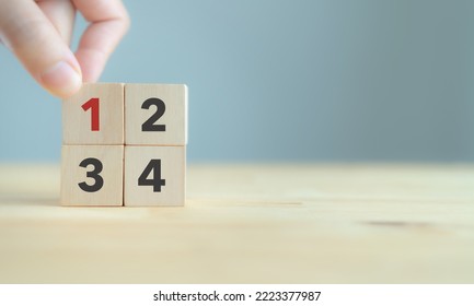 Task priority and management concept. The order of priority in any activity. Set work priority, arrange to do list. Wooden cubes with number first, second, third and fourth.