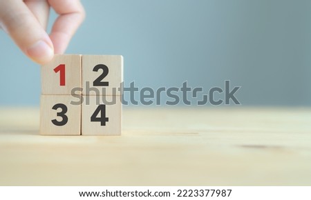 Task priority and management concept. The order of priority in any activity. Set work priority, arrange to do list. Wooden cubes with number first, second, third and fourth.