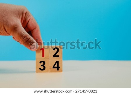 Task priority and management concept. The order of priority in any activity. Set work priority, arrange to do list. Wooden cubes with number first, second, third and fourth.