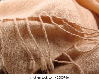 Tassels And Folds Of A Pale Pink Pashmina Wool Shawl