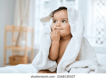 I taste so fresh. Shot of an adorable baby covered in a towel after bath time. - Shutterstock ID 2268130107