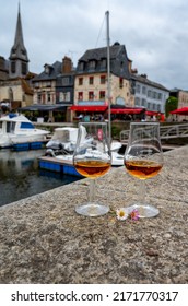 Tasting Of Apple Calvados Drink From Glasses In Old Honfleur Harbour With Boats And Old Houses On Background, Normandy, France