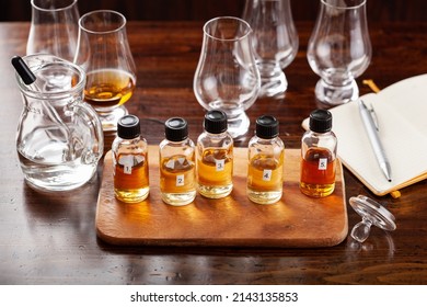 tasting bottles and glasses of whisky spirit brandy cognac. tasting at home