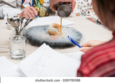 Tasting And Evaluation Of Food By A Certified Specialist. A Professional Taster Assesses The Dessert