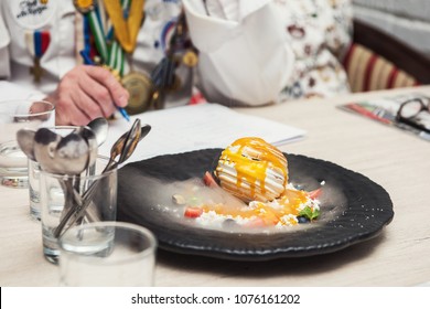 Tasting And Evaluation Of Food By A Certified Specialist. A Professional Taster Assesses The Dessert