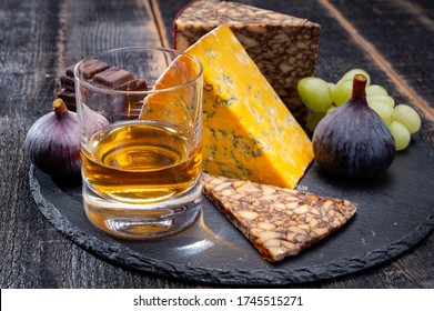 Tasting Of Irish Blended Whiskey And Cheeses From Ireland And UK, Dark Background