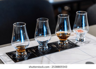 Tasting session with whiskey samples and cocktail preparations at a bar - Powered by Shutterstock