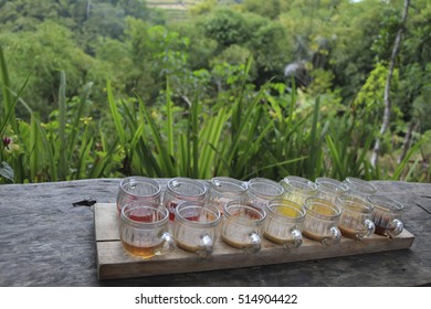 tasting set of different sorts of of tea and coffee in cups 