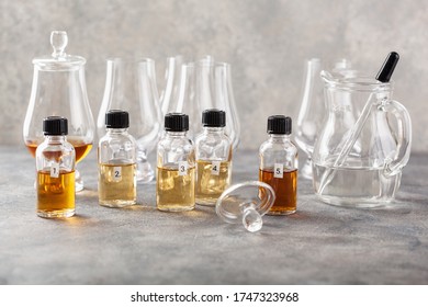 Tasting Whisky Bottles And Glasses Or Spirit Brandy Cognac. Tasting At Home