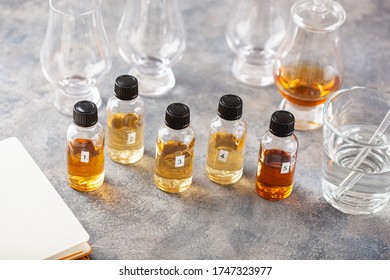 Tasting Whisky Bottles And Glasses Or Spirit Brandy Cognac. Tasting At Home