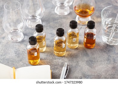 Tasting Whisky Bottles And Glasses Or Spirit Brandy Cognac. Tasting At Home