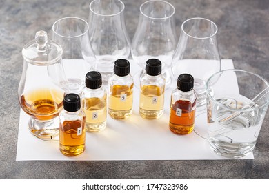 Tasting Whisky Bottles And Glasses Or Spirit Brandy Cognac. Tasting At Home