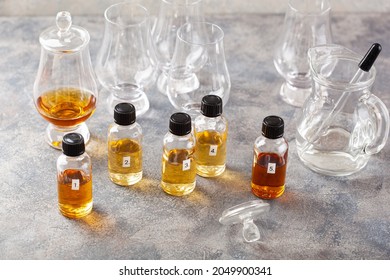 Tasting Whisky Bottles And Glasses Or Spirit Brandy Cognac. Tasting At Home