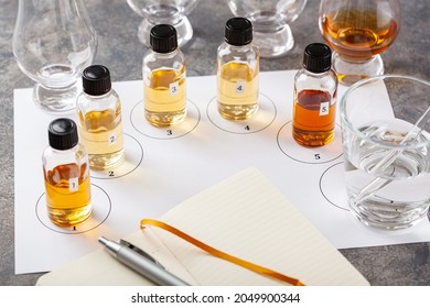 Tasting Whisky Bottles And Glasses Or Spirit Brandy Cognac. Tasting At Home