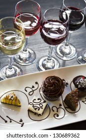 Tasting Of Wine And Pattie Chocolate Pastries.