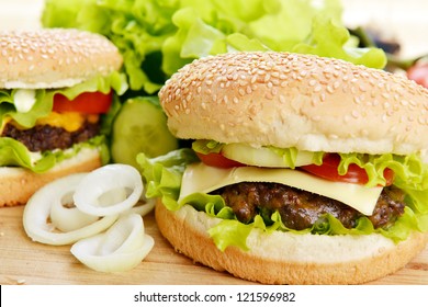 Tasty and appetizing hamburger on wooden  plate