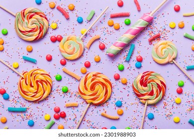 Tasty appetizing Party Accessories Happy Birthday Sweet. Different types of candies on colored background, copy space. Colorful birthday party background. - Powered by Shutterstock