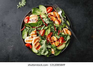 Tasty Appetizing Salad With Grilled Chicken, Tomatoes, Cucumbers, Kale Spinach Served On Plate On Dark Background. View From Above. Horizontal With Copy Space. 