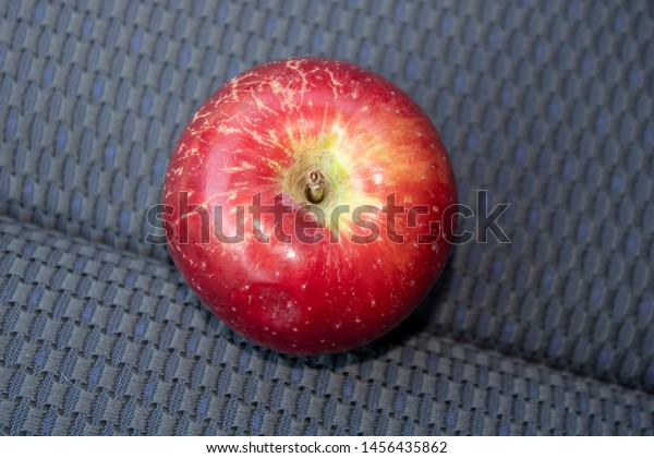 Tasty apple on the car\
seat