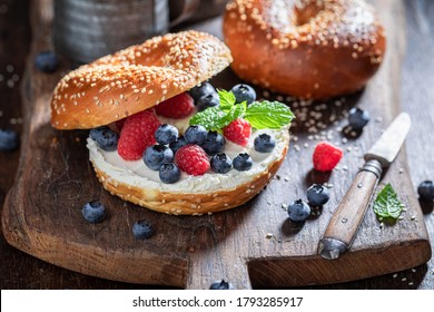Tasty bagel with berries, and cottage cheese for quick lunch