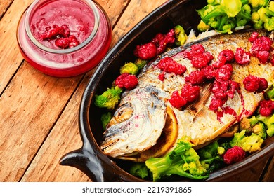 Tasty Baked Whole Fish In Fruit Marinade On Old Wooden Table