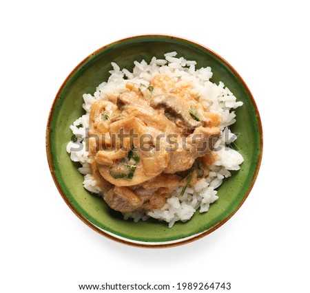 Tasty beef stroganoff with rice on white background