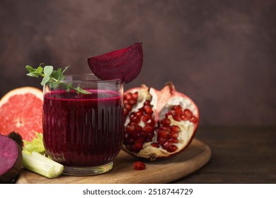 Tasty beetroot smoothie in glass, fresh vegetables and fruits on wooden table, closeup with space for text. Vegan drink - Powered by Shutterstock