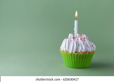 Tasty Birthday Cupcake With Candle, On Green Background, With Free Space