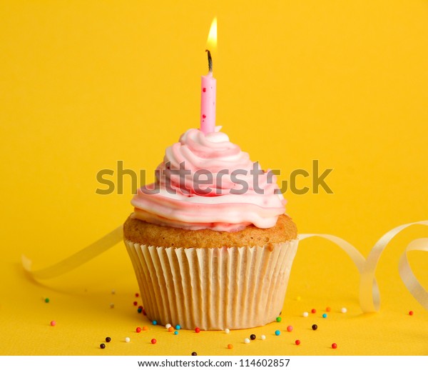 Tasty Birthday Cupcake Candle On Yellow Stock Photo 114602857 ...