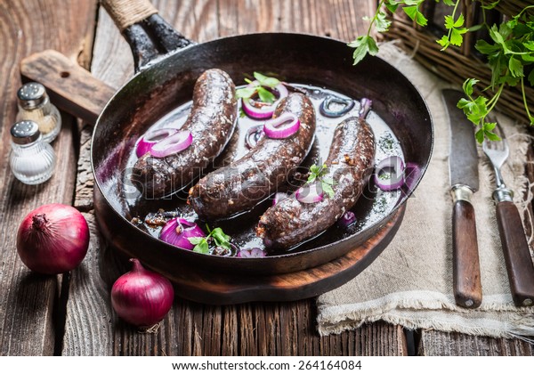 Tasty black pudding\
with onion and parsley
