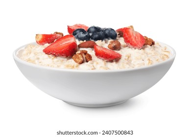 Tasty boiled oatmeal with berries and nuts in bowl isolated on white