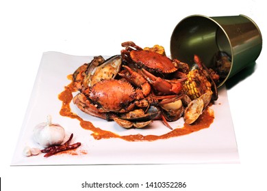 Tasty Boiling Seafood In The Bucket With Crab Shrimp Prawn Mussel Clam Corn On The Cob And Sauce On White Background