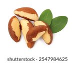 Tasty Brazil nuts and green leaves isolated on white, top view