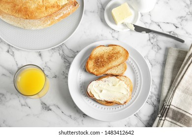 Tasty Bread With Butter Served For Breakfast On Marble Table, Top View