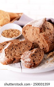 Tasty bread on table on light background - Shutterstock ID 250031359