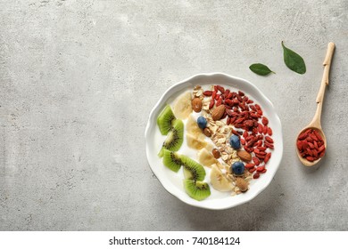 Tasty breakfast with goji berries in dish on table - Powered by Shutterstock