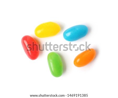 Tasty bright jelly beans isolated on white, top view