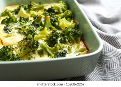 Tasty Broccoli Casserole In Baking Dish On Table, Closeup