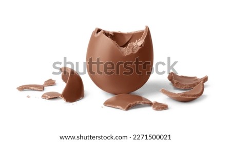 Tasty broken chocolate egg isolated on white