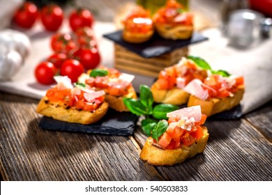 Tasty bruschetta with tomato,  basil, parmesan, olive oil ... - Shutterstock ID 540503833