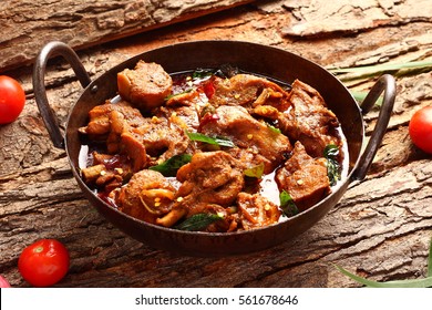 Tasty Butter Chicken Curry Dish Form Indian Cuisine In A Cast Iron Cookware,