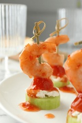 Tasty Canapes With Shrimps, Vegetables And Cream Cheese On White Table, Closeup
