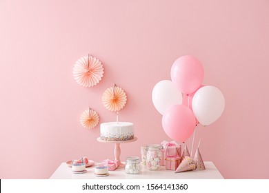 Tasty Candy Bar For Birthday Party On Table Against Color Background