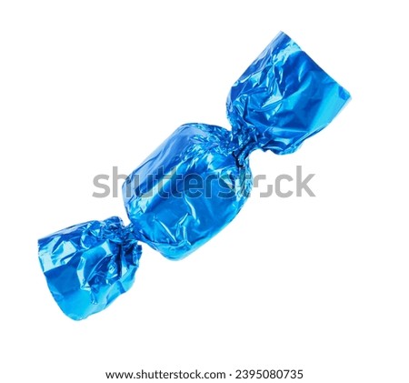 Tasty candy in light blue wrapper isolated on white