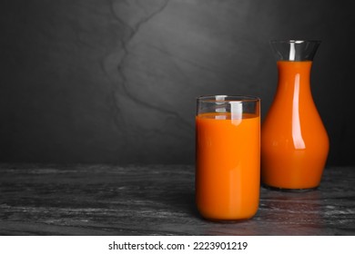 Tasty Carrot Juice On Black Marble Table, Space For Text