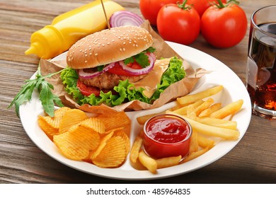 Tasty cheeseburger with fries and ketchup, closeup - Powered by Shutterstock