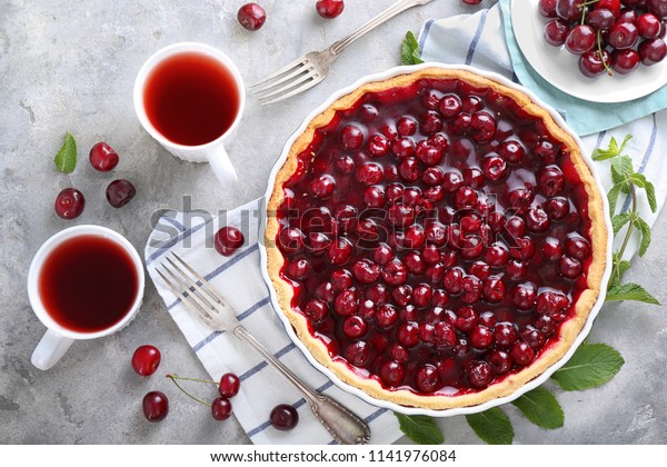 Tasty cherry pie on\
table