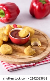 Tasty Chicken Nuggets with Tomato Sauce on Wooden Tray Light Gray Background Vertical