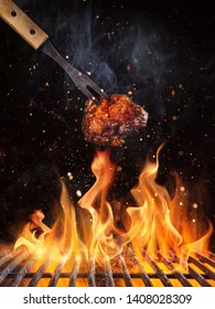 Tasty chicken piece on the grill with fire flames - Shutterstock ID 1408028309