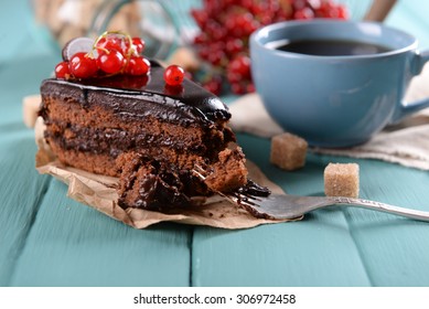 Tasty Chocolate Cake With Berries And Cup Of Tea On Table Close Up